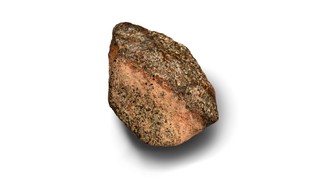 A rose-colored rock on a white background.