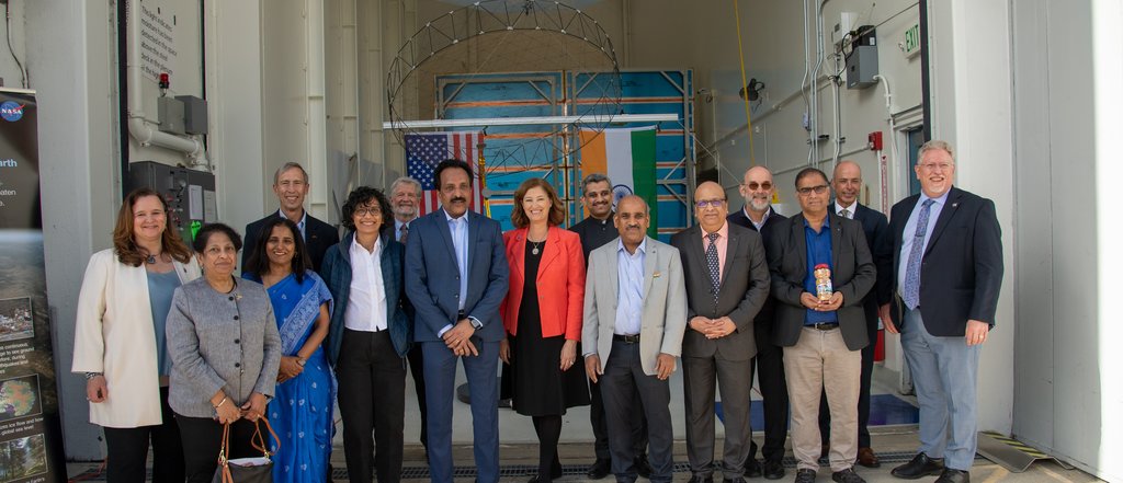 Men and women from US and India gathered for group photo of NISAR mission leadership