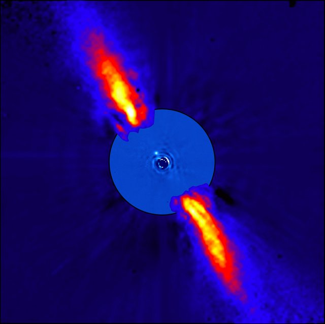 Rays of bright orange and red shoot out diagonally from a blue circle surrounding the star Beta Pictoris