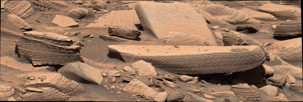 Description Billions of years ago, an hours-long Martian sandstorm blew so intensely that sand ripples began to climb upon one another as they moved across the surface. These layers of sediment eventually hardened into the multilayered rocks seen in...