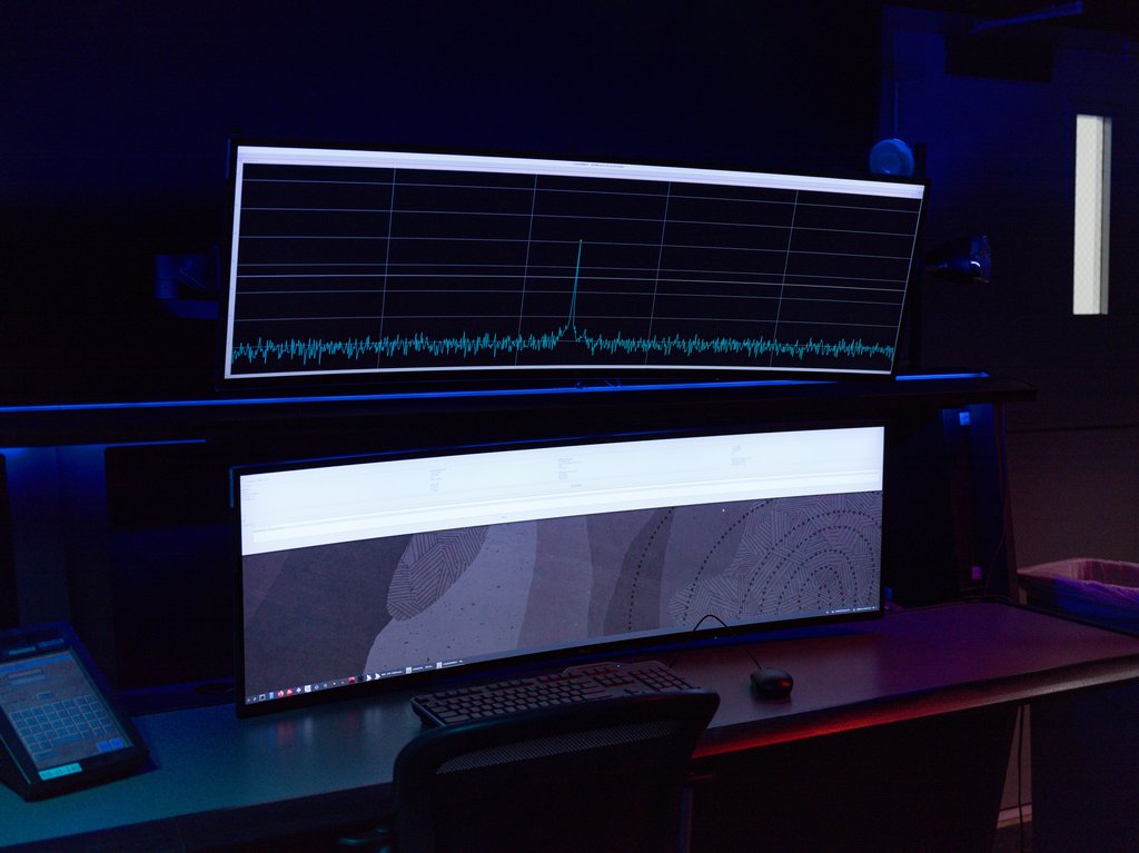 Description The acquisition of the radio frequency signal from the Artemis II crewed mission to the Moon by NASA’s Deep Space Network (DSN) is indicated by the peak in the data signal shown on the top computer screen.  Soon after the mission’s launch...