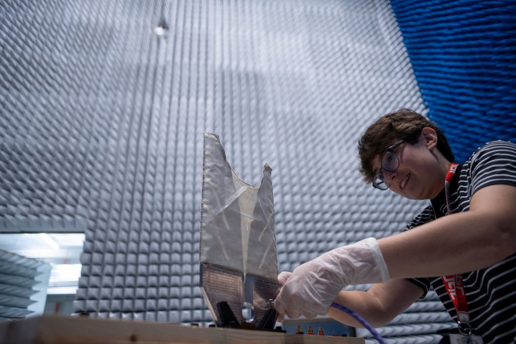 Description SkyFall ground-penetrating radar engineer Maya Román connects a coaxial cable to a test antenna in the Environmental Test Lab’s electromagnetic interference testing chamber at NASA’s Jet Propulsion Laboratory in Southern California. The...