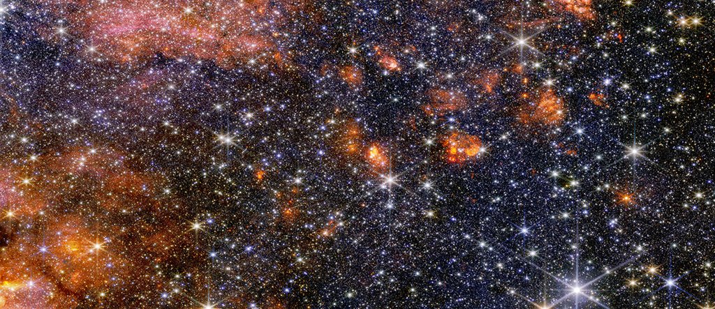 Stars, gas and cosmic dust in the Sagittarius B2 molecular cloud glow in  near-infrared light