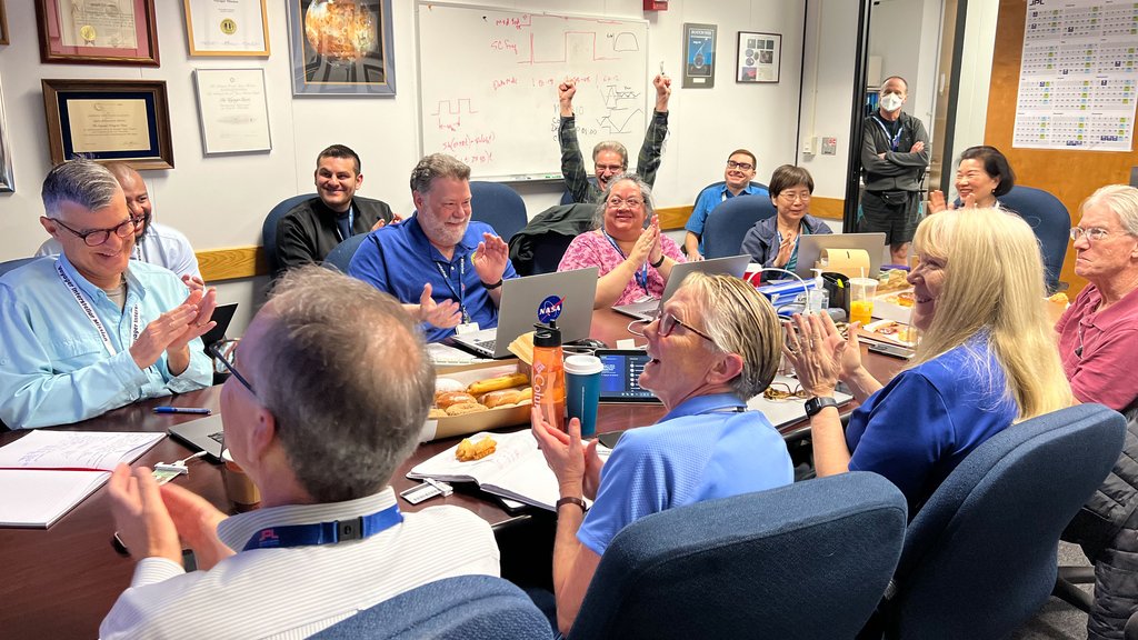 After receiving data about the health and status of Voyager 1 for the first time in five months, members of the Voyager flight team celebrate in a conference room at NASA’s Jet Propulsion Laboratory on April 20.