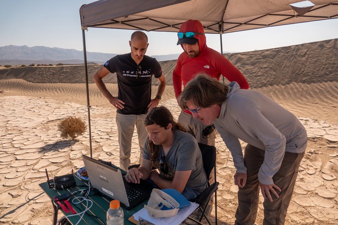 e1-PIA26675-Researchers Monitor Drone Testing in a Pop-Up Tent