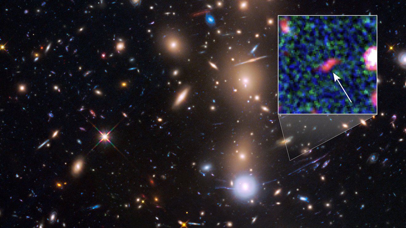 NASA Space Telescopes See Magnified Image of Faintest Galaxy from Early