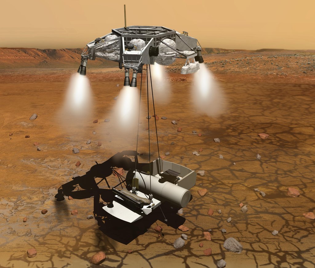 This artist's concept of a proposed Mars sample return mission portrays a rocket-powered descent stage lowering a sample-retrieving rover and an ascent vehicle to the surface.