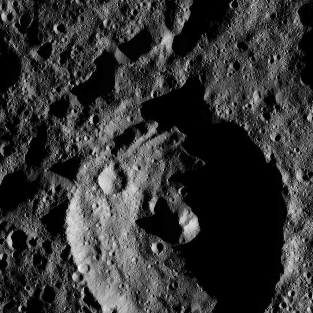 This view from NASA's Dawn spacecraft shows a crater in the southern hemisphere of Ceres with a prominent central peak. The image is centered at approximately 63 degrees south latitude, 143 degrees east longitude. Dawn captured the scene on Dec. 24, 2015.