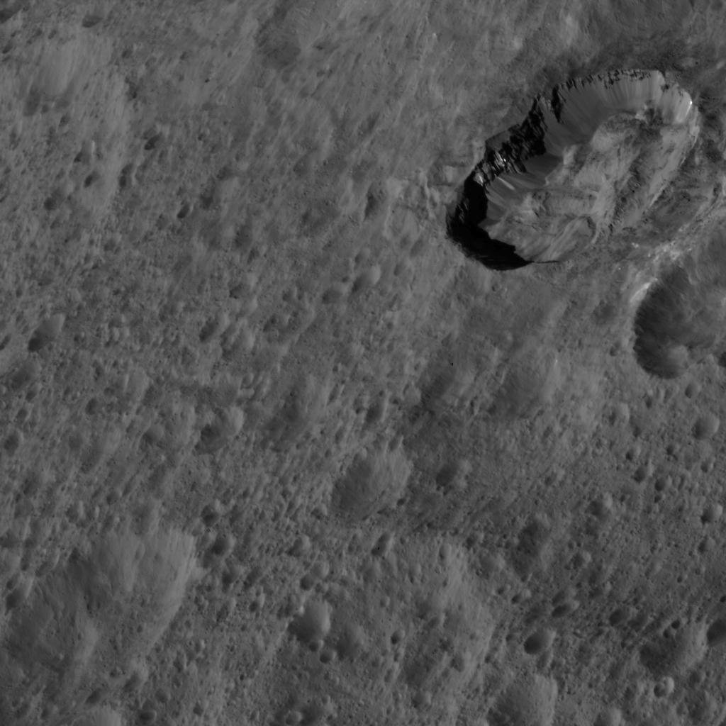 This image of Ceres from NASA's Dawn spacecraft was taken at an oblique viewing angle relative to the surface. The crater to the upper right is named Juling which displays prominent spurs of compacted material along its walls.