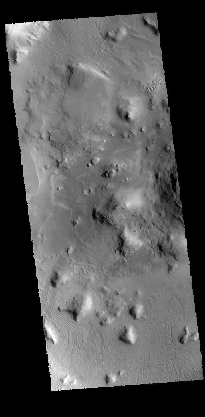 This image captured by NASA's 2001 Mars Odyssey spacecraft shows part of the floor of an unnamed crater on the northern edge of Terra Sabaea.