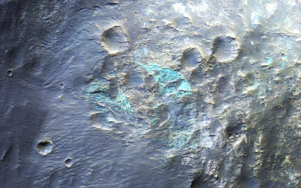 This image captured by NASA's Mars Reconnaissance Orbiter covers the western rim of Holden Crater during northern summer. Since Holden Crater is in the Southern hemisphere of Mars, the shadows are long in northern summer (southern winter).