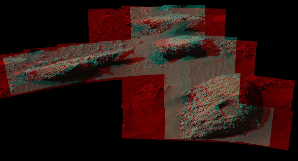The rock in the foreground at right in this 3D scene is informally named 'Balombo.' The group of boulders is at a site called 'Bimbe.' NASA's Curiosity Mars Rover shows boulders composed of pebble-size and larger rock fragments.