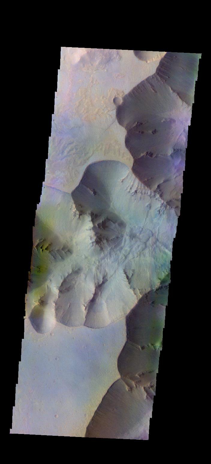 The THEMIS camera contains 5 filters. The data from different filters can be combined in multiple ways to create a false color image. This image from NASA's 2001 Mars Odyssey spacecraft shows part of Juventae Chasma.