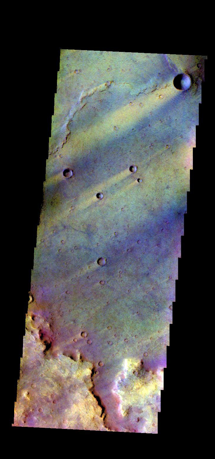 The THEMIS camera contains 5 filters. The data from different filters can be combined in multiple ways to create a false color image. This image from NASA's 2001 Mars Odyssey spacecraft shows part of Syrtis Major Planum.