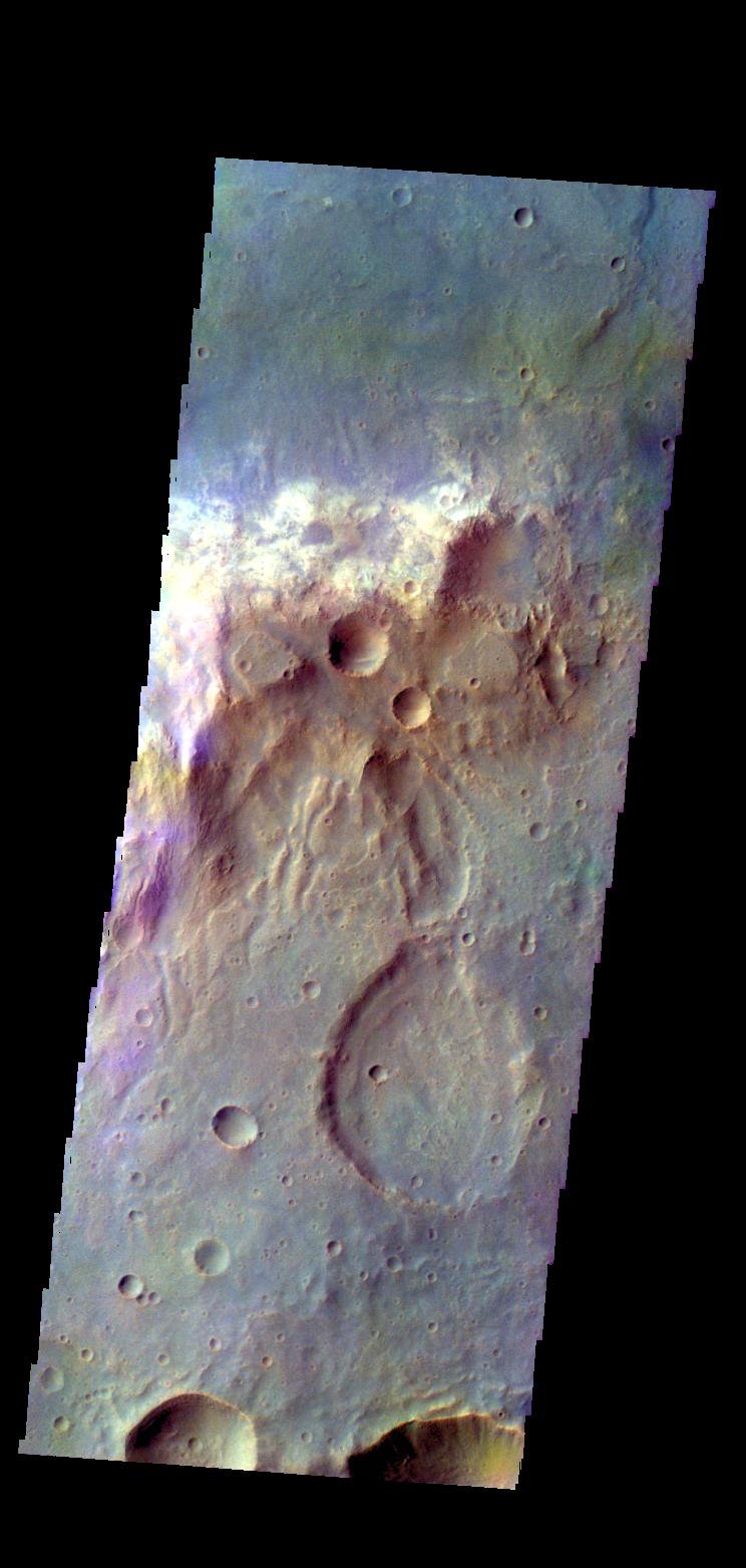 The THEMIS camera contains 5 filters. The data from different filters can be combined in multiple ways to create a false color image. This image from NASA's 2001 Mars Odyssey spacecraft shows part of the plains of Tyrrhena Terra.