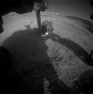 NASAs Curiosity Mars rover captured this view of its robotic arm during sunset on Sept. 16, 2025.